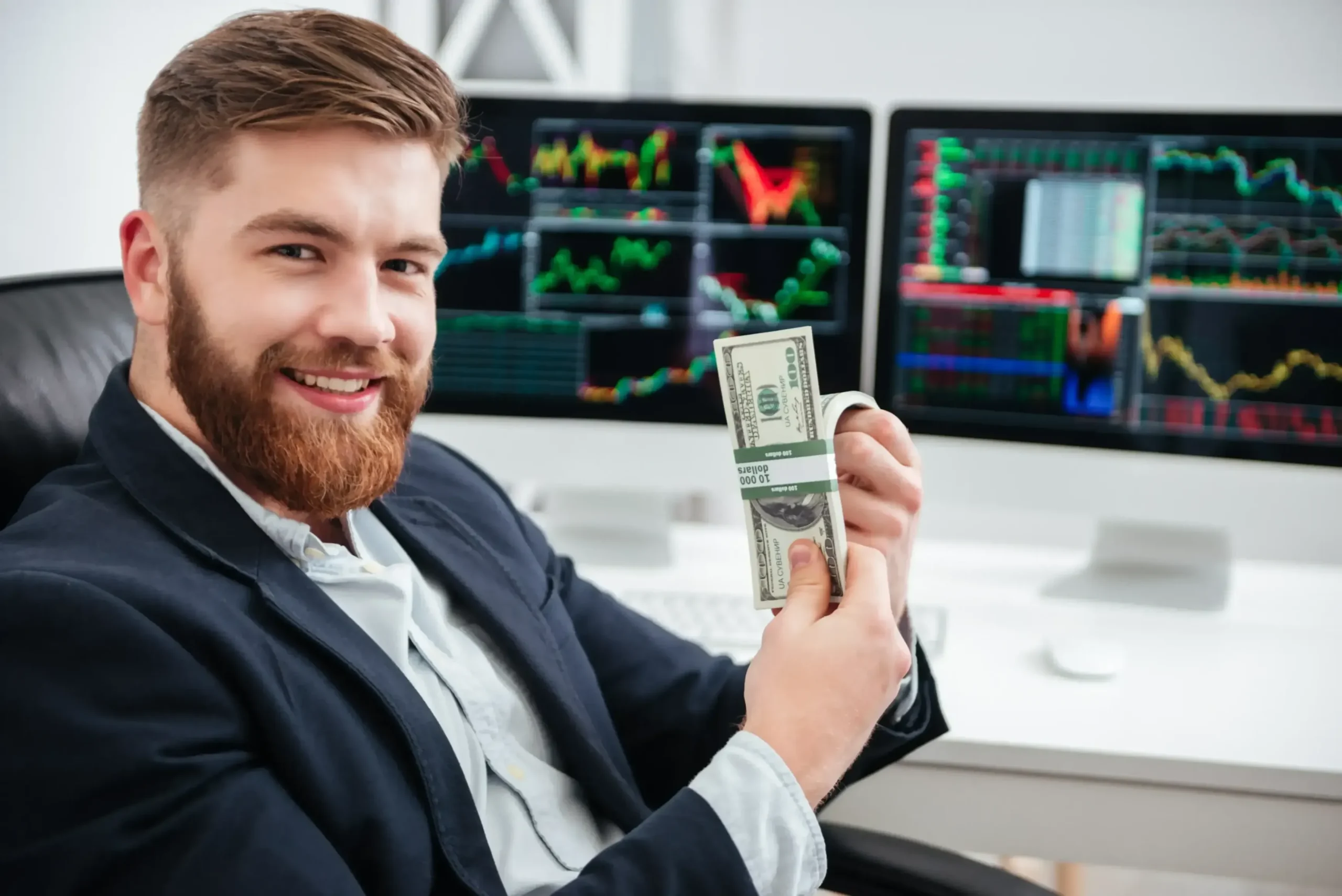 smiling-bearded-professional-holding-money-in-office-SBI-302894582